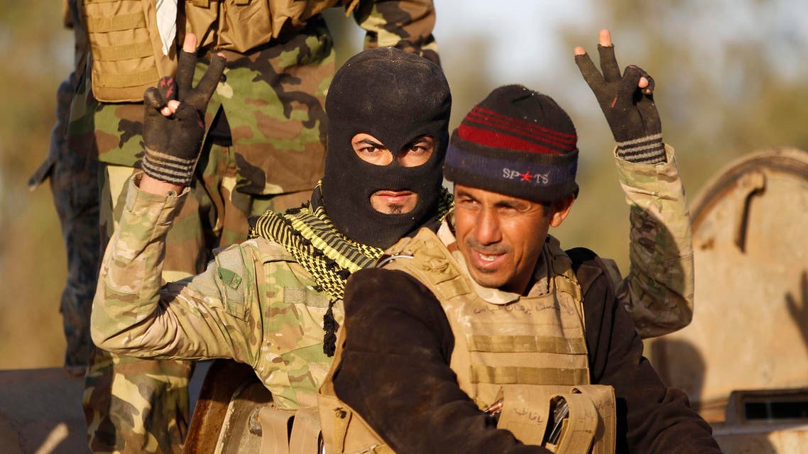 A Shi'ite fighter gestures during clashes with Islamic State militants in Salahuddin province March 2, 2015. Reuters