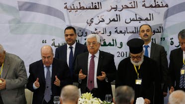 Palestinian President Mahmoud Abbas (C) prays at the start of a meeting for the Central Council of the Palestinian Liberation Organization. (Reuters)