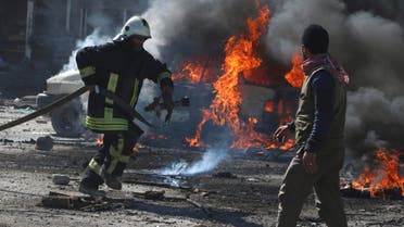 A civil defence member attempts to put out a fire from a burning vehicle at a site hit by what activists said was a barrel bomb dropped by forces loyal to Syria's President Bashar al-Assad in the Qadi Askar neighbourhood of Aleppo March 5, 2015. (Reuters)