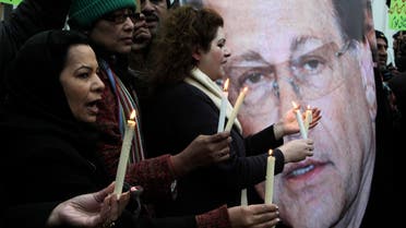 Activists hold candles to observe the second anniversary of the assassination of Pakistani governor Salman Taseer in Lahore, Pakistan on Friday, Jan. 4, 2013.  (AP)