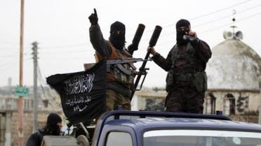 Members of al Qaeda's Nusra Front gesture as they drive in a convoy touring villages, which they said they have seized control of from Syrian rebel factions, in the southern countryside of Idlib, December 2, 2014. (File photo: Reuters)