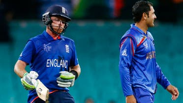 England's Ian Bell (L) reacts after hitting the winning runs as Afghanistan's Mohammad Nabi looks on during their Cricket World Cup match at the Sydney Cricket Ground (SCG) March 13, 2015. (Reuters)