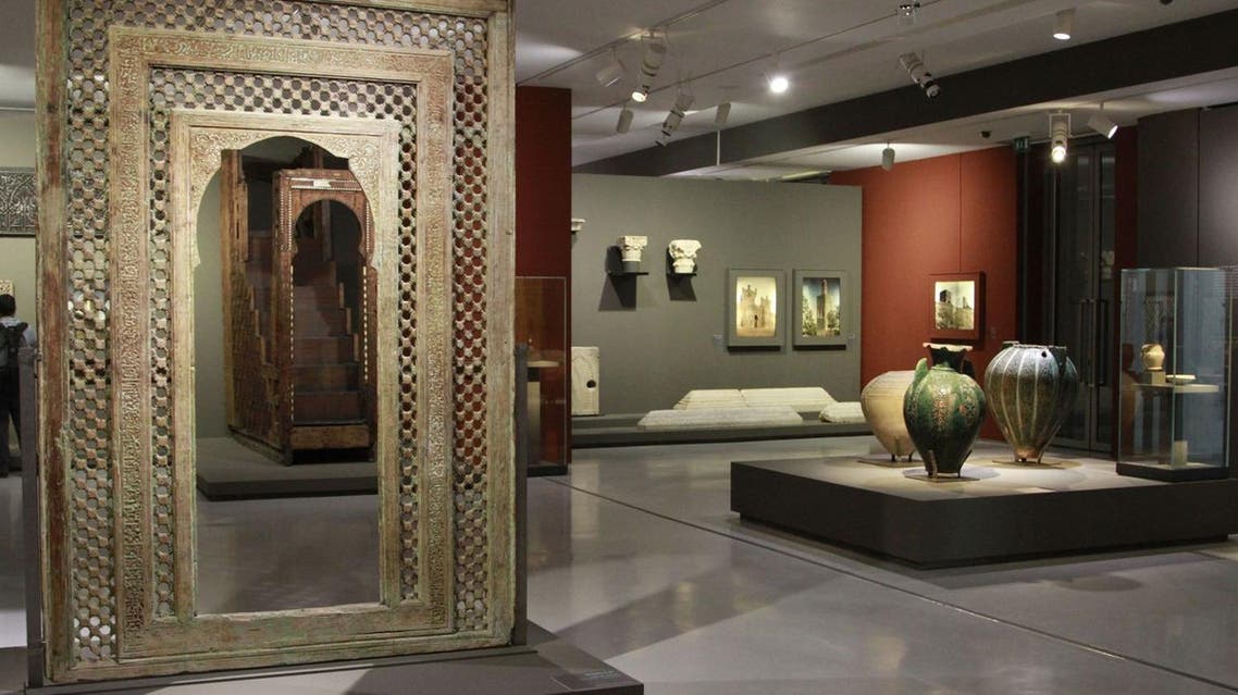 This photo taken March 4, 2015 shows a carved wooden medieval doorway from the Moroccan city of Fez dominating the exhibition room at the Mohammed VI Museum of Modern and Contemporary art in Rabat, Morocco. (AP)