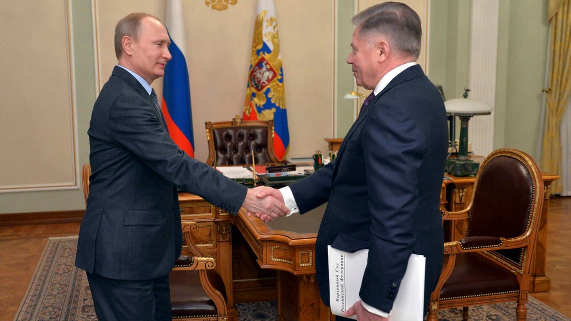 Russian President Vladimir Putin (L) shakes hands with Supreme Court chairman Vyacheslav Lebedev during their meeting at the Novo-Ogaryovo state residence outside Moscow March 13, 2015. (Reuters)