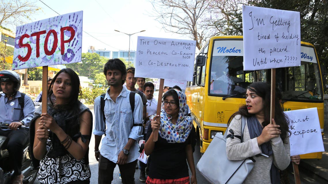 Students of a fashion design school hold placards during a protest against the rapists convicted in the Dec. 16, 2012 gang rape in a moving bus in New Delhi, in Bangalore, India, Friday, March 13, 2015. AP