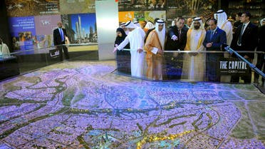 Egyptian President Abdel Fattah al-Sisi (R), United Arab Emirates (UAE) counterpart Sheikh Mohammed bin Rashid al-Maktoum (2nd R), and Egyptian investment minister Ashraf Salman (3rd R) look at a scale model of the new Egyptian capital Cairo displayed at the congress hall in the Red Sea resort of Sharm el-Sheikh, in this March 14, 2015 handout photo. (Reuters)