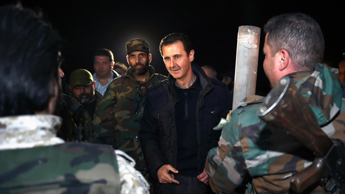 Syrian President Bashar Assad, center, speaks with Syrian troops during his visit on the front line in the eastern Damascus district of Jobar, Syria. (File: AP)