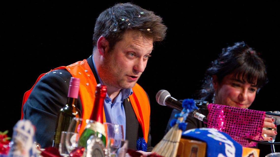 Yassin Musharbash of German weekly 'Die Zeit' reads from a letter-to-the-editor during the 'Hate Poetry' show in the Theaterlabor in Bielefeld, Germany. (AP)