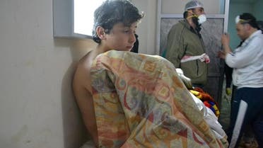  A young man sits on a bed on March 17, 2015 at a clinic in the village of Sarmin, southeast of Idlib, the capital of Syria's northwestern province of Idlib, following reports of suffocation cases related to an alleged regime gas attack in the area. (AFP)