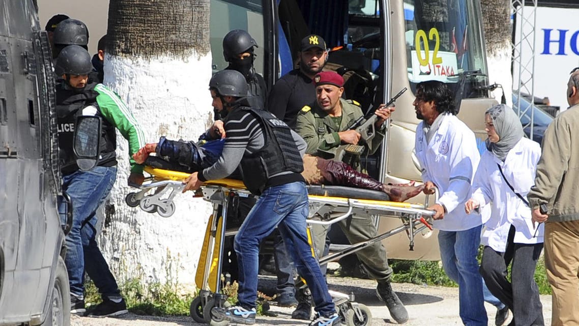 A victim is being evacuated by rescue workers outside the Bardo museum in Tunis, Wednesday, March 18, 2015 in Tunis, Tunisia. (AP)