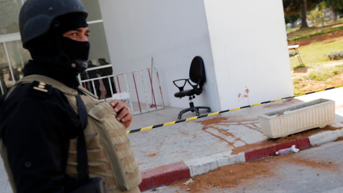 A policeman guard the entrance of the Bardo museum in Tunis, Tunisia, Thursday, March 19, 2015, as a a blood stain is seen at right, a day after gunmen opened fire killing over 20 people, mainly tourists. (AP)