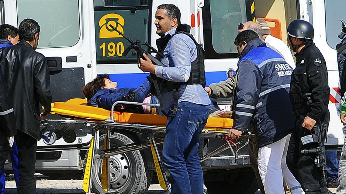 A victim is being evacuated by rescue workers outside the Bardo musum in Tunis, Wednesday, March 18, 2015 in Tunis, Tunisia. AP