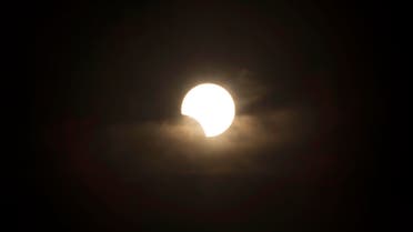 The moon crosses in front of the sun during a partial solar eclipse. (File photo: AP)
