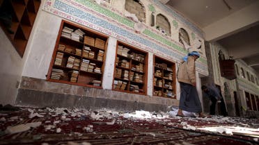 A Houthi militant walks after a suicide bomb attack at a mosque in Sanaa March 20, 2015. (Reuters)