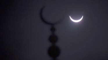 A partial solar eclipse in seen above a mosque in Oxford, central England March 20, 2015. (Reuters)