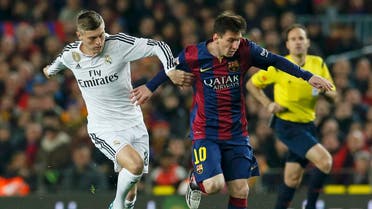 Barcelona’s Lionel Messi (R) challenges Real Madrid’s Toni Kroos during their Spanish first division “Clasico” soccer match at Camp Nou stadium in Barcelona, March 22, 2015. (Reuters)