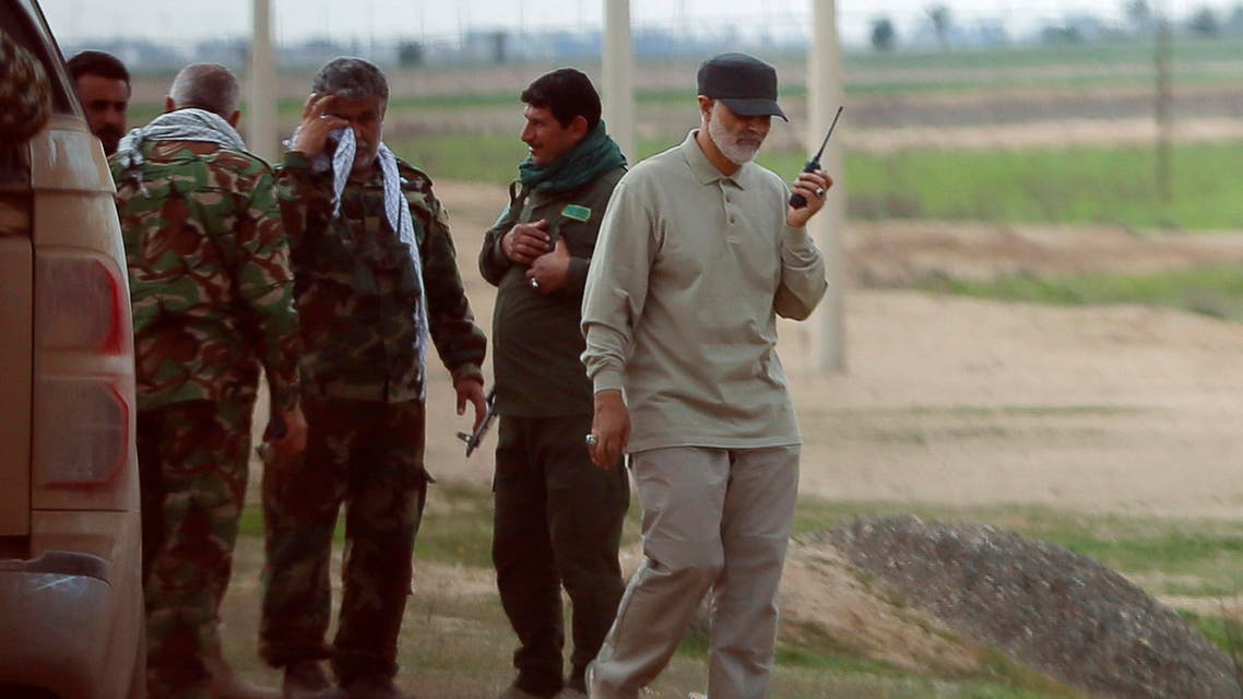Iranian Revolutionary Guard Commander Qassem Soleimani uses a walkie-talkie at the frontline during offensive operations against ISIS militants in Salahuddin province March 8, 2015. (Reuters)