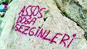 Graffiti near ancient mountain paintings stirs anger in Turkey