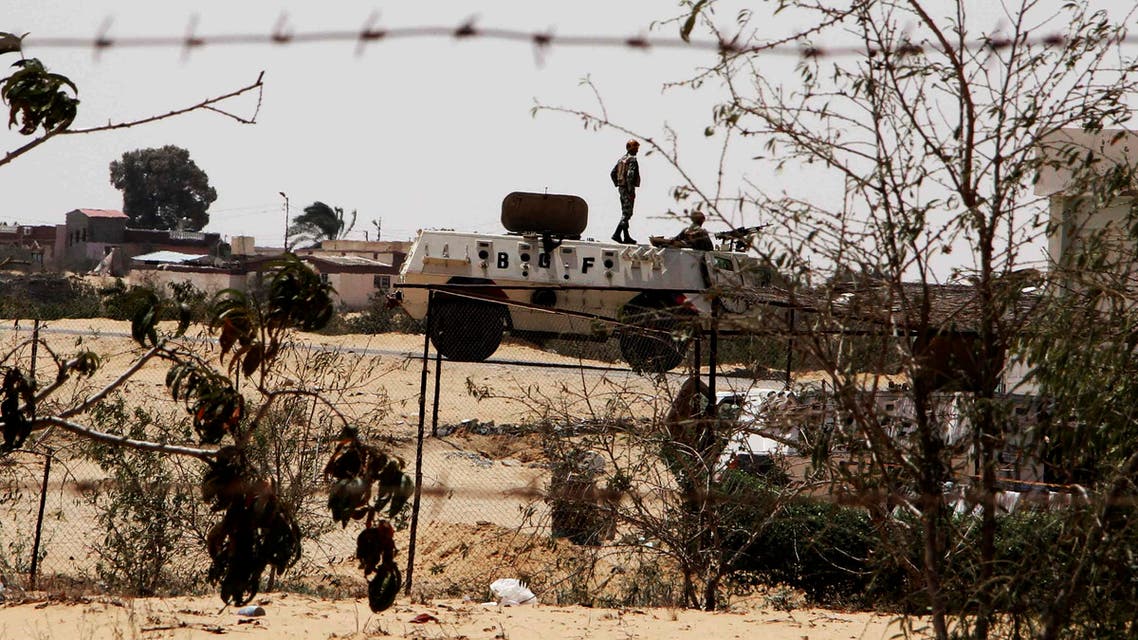 In this Monday, Aug. 6, 2012 file photo, Egyptian border guards patrol near the border with Israel in Rafah, Egypt. AP