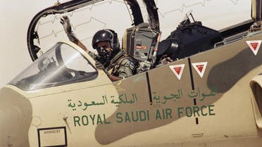 A pilot of the Royal Saudi Air Force waves to ground personnel to take off in his American made F-15 Eagle Fighter Jet on Wednesday, August 15, 1990 at an Air Base in Saudi Arabia. (AP)