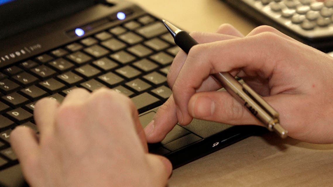 In this Feb. 1, 2012 file photo, a student works with a computer and a calculator at Reynoldsburg High School in Reynoldsburg, Ohio. According to a new survey from Pew Research Center released Monday, March 16, 2015, more than half of Americans are worried about the U.S. government’s digital spies prying into their emails, texts, search requests and other online information, but few are trying to thwart the surveillance. (AP)