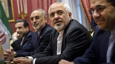 Iranian Foreign Minister Javad Zarif (2nd R) waits for the start of a meeting with a US delegation at the Beau Rivage Palace Hotel in Lausanne on March 26, 2015 during negotiations on the Iranian nuclear program. (Reuters)