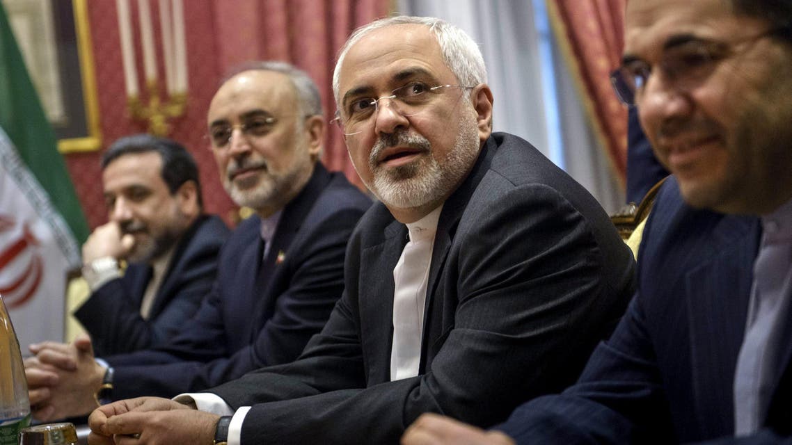 Iranian Foreign Minister Javad Zarif (2nd R) waits for the start of a meeting with a US delegation at the Beau Rivage Palace Hotel in Lausanne on March 26, 2015 during negotiations on the Iranian nuclear program. (Reuters)