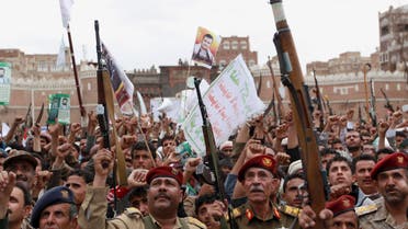 Houthis hold up their weapons to protest against Saudi-led airstrikes, during a rally in Sanaa, Yemen, Thursday, March 26, 2015. (AP)