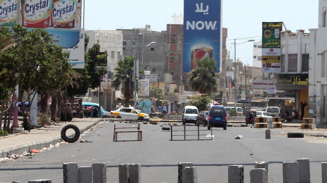 Bricks and obstacles are placed in the middle of the street to create a road block in the northern entrance of the southern Yemeni city of Aden on March 27, 2015. (AFP)