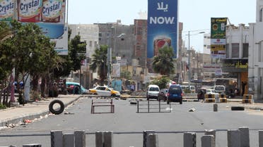 Bricks and obstacles are placed in the middle of the street to create a road block in the northern entrance of the southern Yemeni city of Aden on March 27, 2015.  (AFP)