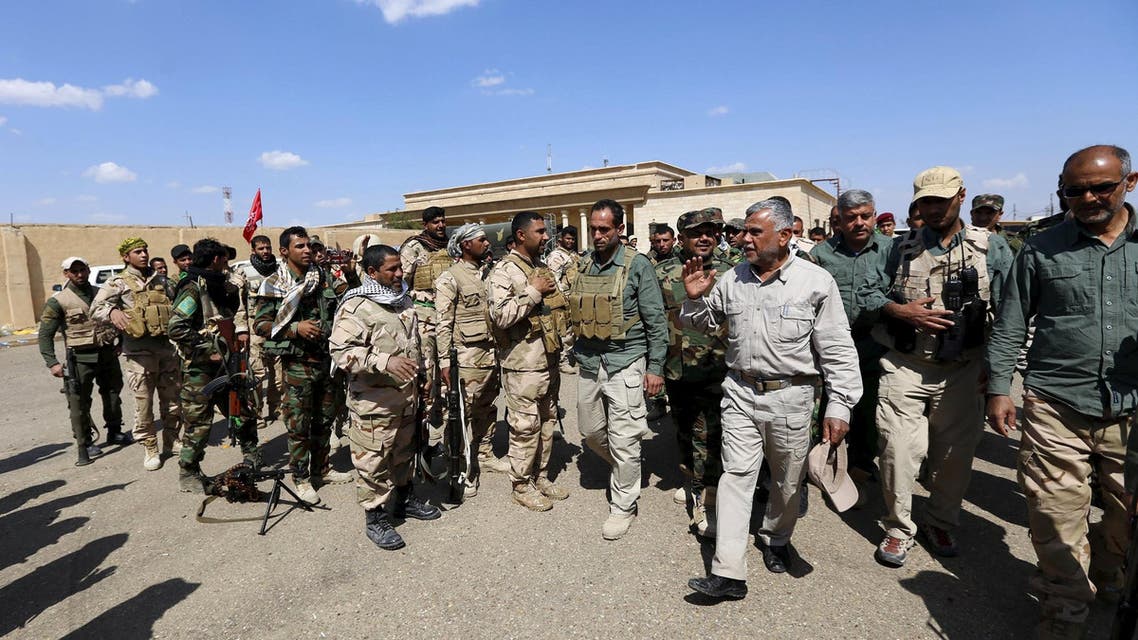 Head of the Badr Organisation and Shi'ite paramilitary commander Hadi al-Amiri (3nd R) Inspects Hashid Shaabi (Popular Mobilisation) allied with Iraqi forces against ISIS in a town on the outskirts of Tikrit March 26, 2014. (Reuters)