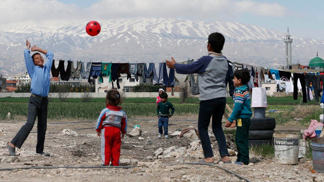 Syrian children play with a ball at a makeshift settlement for Syrian refugees in Bar Elias, in the Bekaa valley, March 15, 2015. (Reuters)