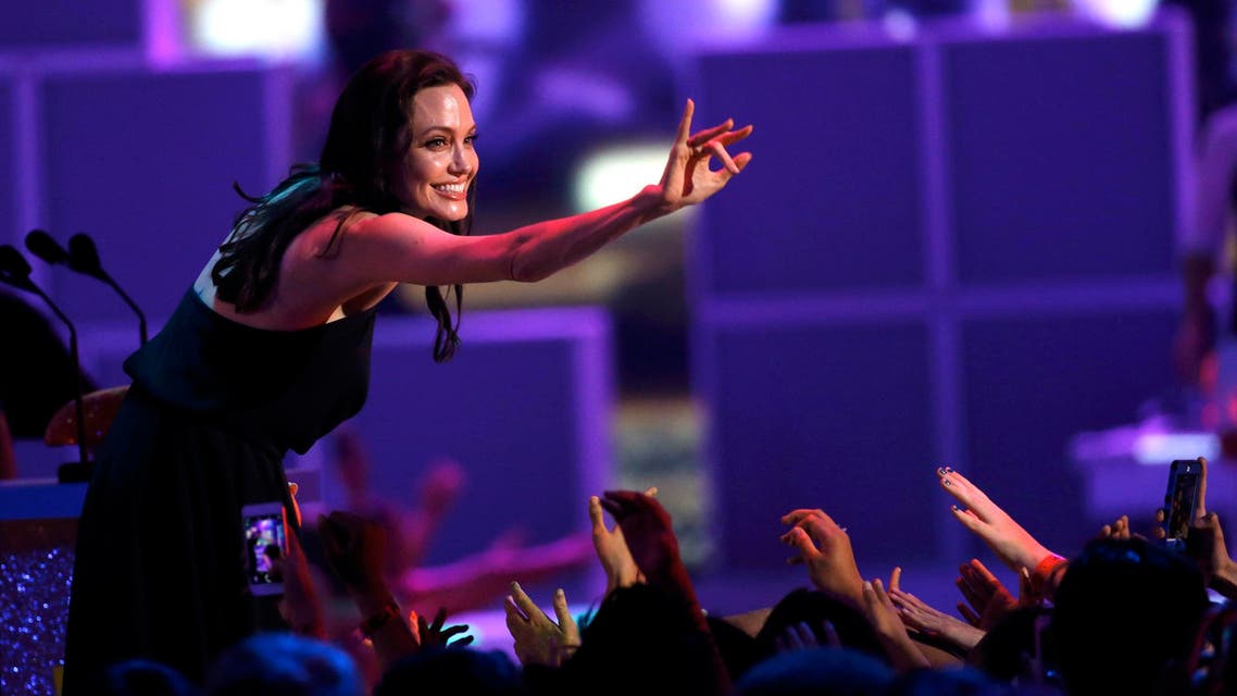 Actress Angelina Jolie waves as she accepts the Best Villain Award at the 2015 Kids' Choice Awards in Los Angeles, California March 28, 2015. Reuters