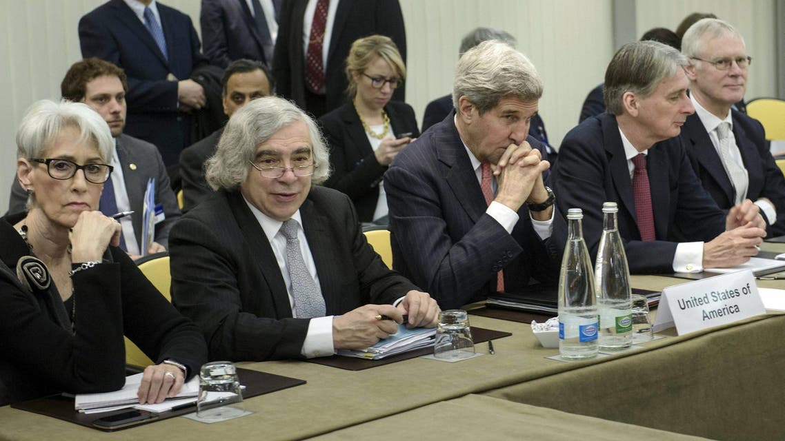 U.S. and British officials wait to start a meeting with P5+1, European Union and Iranian officials as part of talks on Iran's nuclear program at the Beau Rivage Palace Hotel in Lausanne. (Reuters)