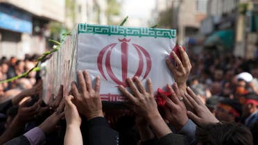 In this picture taken on Sunday, March 29, 2015, and released by the semi official Iranian Fars News Agency, a group of mourners carry the flag draped coffin of Ali Yazdani, a member of Iran's Revolutionary Guard, whom the Guard says has been killed during U.S. drone strike near the Iraqi city of Tikrit. AP