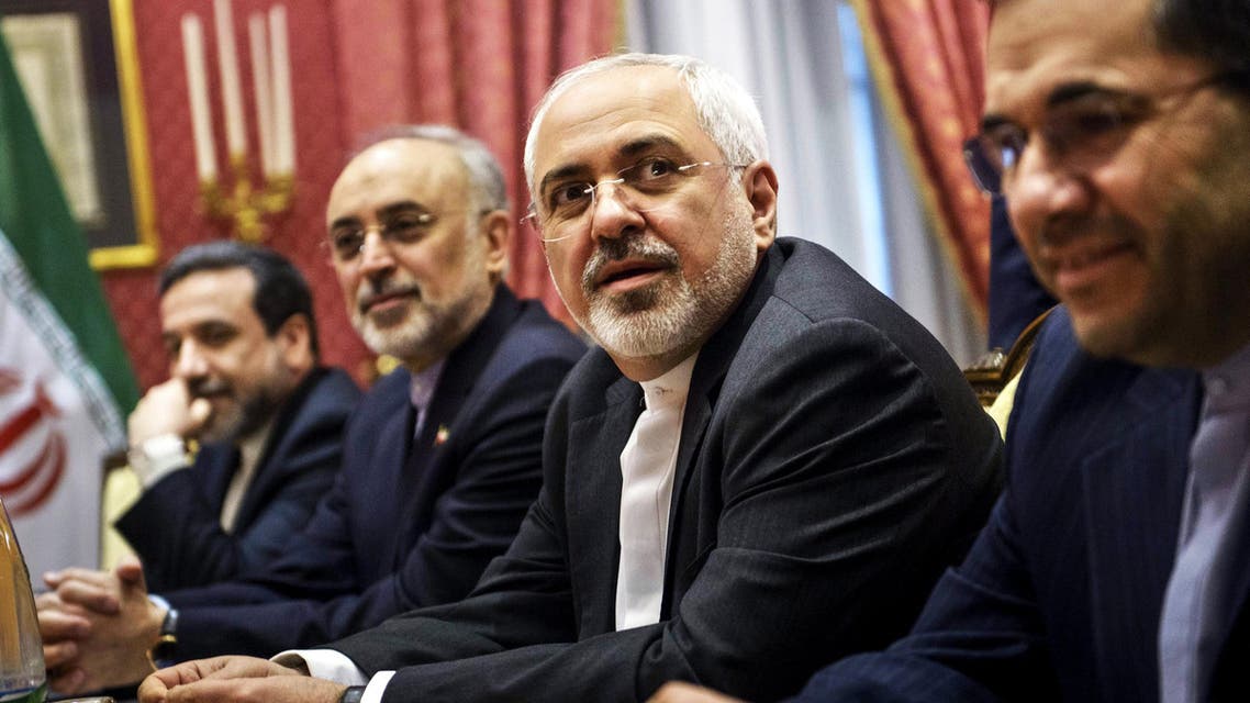 Iranian Foreign Minister Javad Zarif (2nd R) waits for the start of a meeting with a US delegation at the Beau Rivage Palace Hotel in Lausanne on March 26, 2015 during negotiations on the Iranian nuclear program. (Reuters)