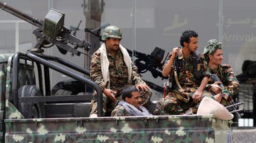 Shiite rebels, known as Houthis, wearing an army uniform, ride on an armed truck to patrol the international airport in Sanaa, Yemen, Saturday, March 28, 2015. AP