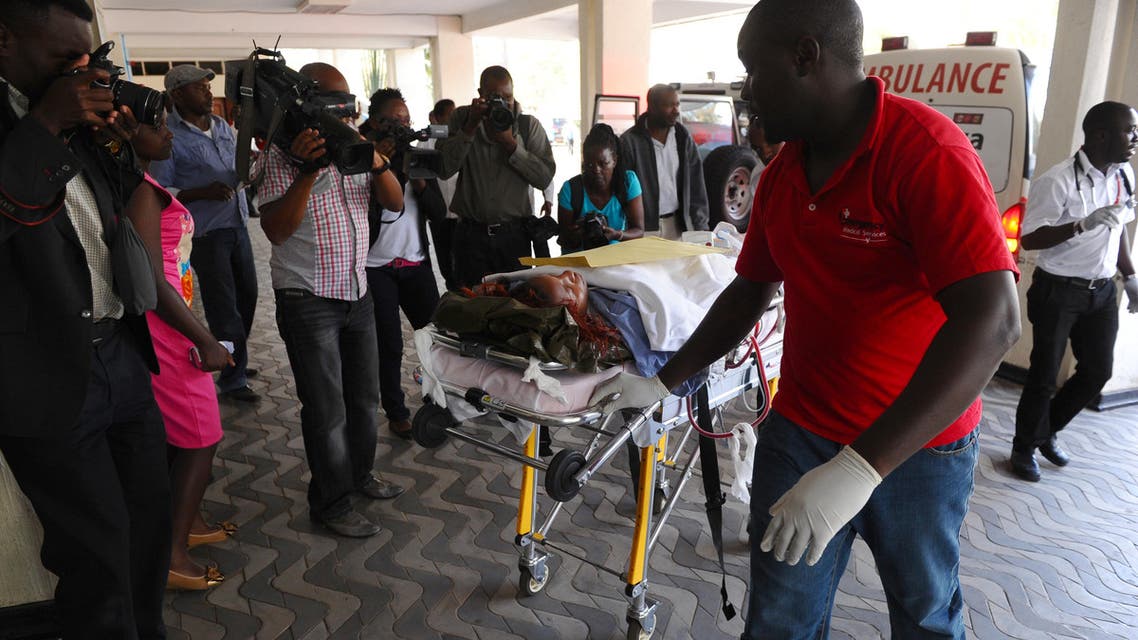 Medics help an injured person at Kenyatta National Hospital in Nairobi, Kenya, after being airlifted from Garissa after an attack by gunmen at Garissa University College. (AP)