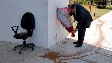 An MP lays flowers next to a a blood stain at the Bardo museum in Tunis, Tunisia, Thursday, March 19, 2015, a day after gunmen opened fire killing over 20 people, mainly tourists. (File Photo:AP)