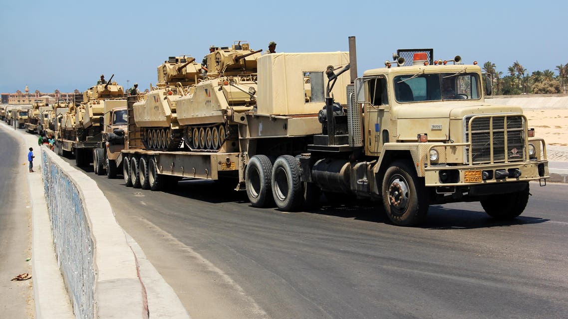 n this Aug. 9, 2012 file photo, army trucks carry Egyptian military tanks in El Arish, Egypt's northern Sinai Peninsula.  (AP)
