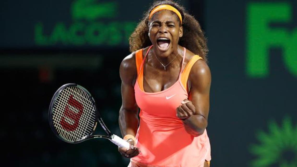Serena Williams celebrates against Simona Halep (not pictured) during a women's singles semi-final on day eleven of the Miami Open at Crandon Park Tennis Center. (Reuters)