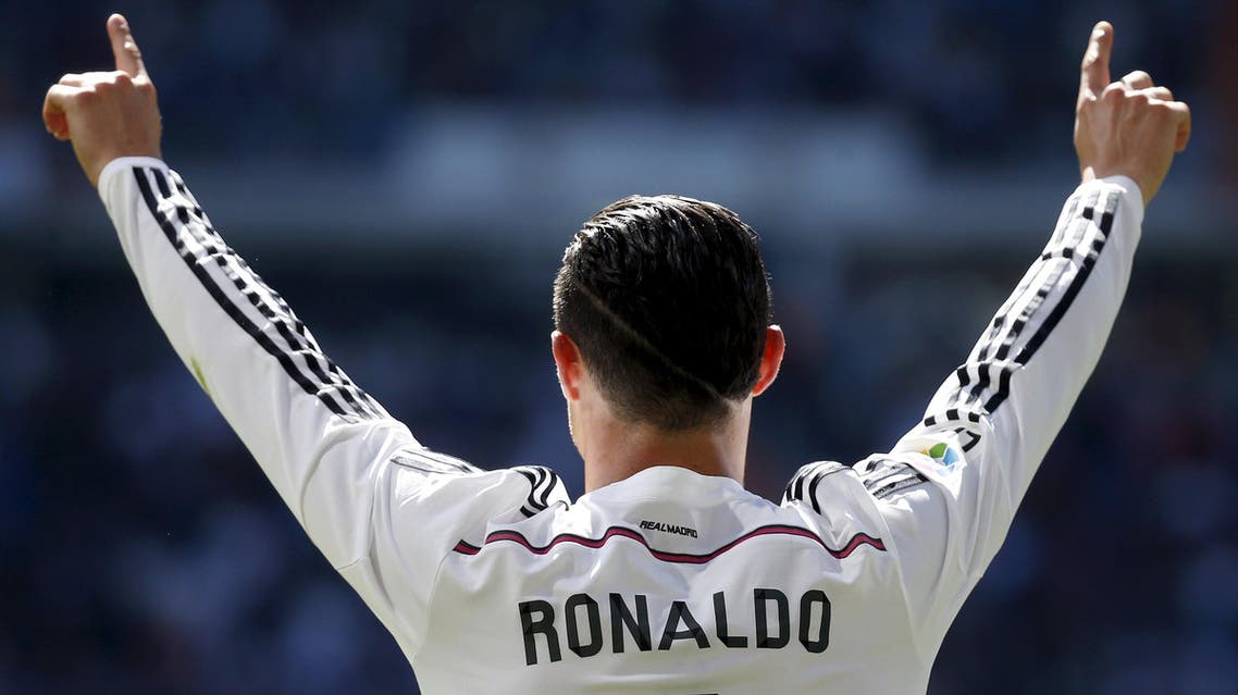 Real Madrid's Cristiano Ronaldo celebrates his goal against Granada during their Spanish first division soccer match at Santiago Bernabeu stadium in Madrid. Reuters