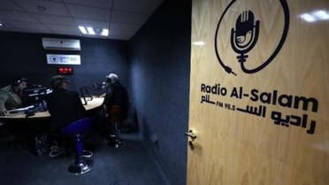 The logo of Radio Al-Salam is seen on the door leading to a broadcast room during the inaugural broadcast on April 5, 2015, in Arbil, the capital of the Kurdish autonomous region in northern Iraq. (AFP)