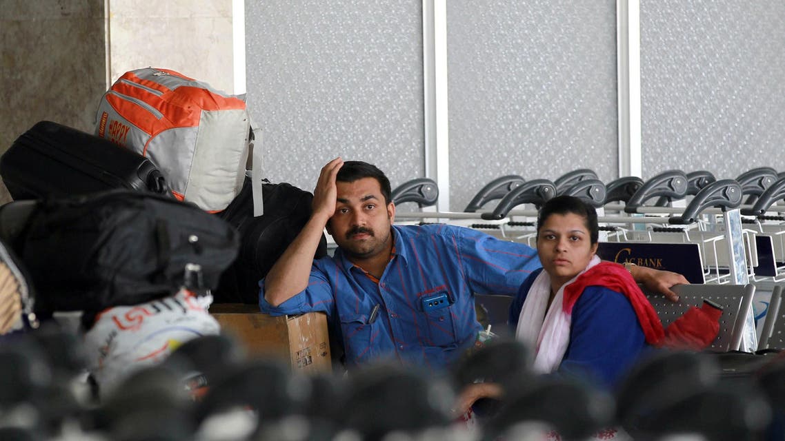 People wait in the departure lounge at Sanaa International Airport on April 6, 2015 as hundreds of foreigners are evacuated from conflict-hit Yemen. (AFP)