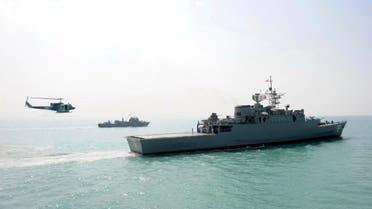 In this Feb. 21, 2010 file photo, a helicopter flies toward Iran's Jamaran guided-missile destroyer, right, during an exercise in the Persian Gulf, off the coast of Iran.  (AP)