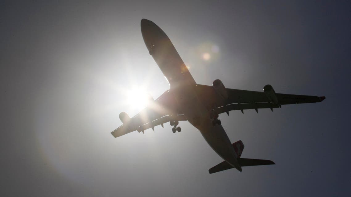 A Swiss International Air Lines Airbus Industrie A340-300 airplane makes its final approach as it lands at Miami International Airport in Miami from Zurich, Switzerland, Monday, May 3, 2010. (AP Photo/Wilfredo Lee)