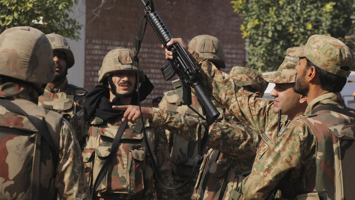 Pakistan army soldiers surround a Shiite mosque attacked by suicide bombers and gunmen in Peshawar, Pakistan, Friday, Feb. 13, 2015. (AP)