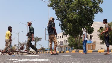 Militants loyal to Yemen's President Abd-Rabbu Mansour Hadi man a checkpoint on a street in the country's southern port city of Aden March 30, 2015. REUTERS
