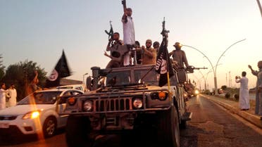 Fighters from ISIS parade in a commandeered Iraqi security forces armored vehicle on the main road at the northern city of Mosul, Iraq. (File Photo: AP)