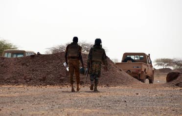 Burkina Faso soldiers patrol near Tambao mine in Tambao, 350 kilometers (220 miles) northeast of the capital, Ouagadougou on April 5, 2015, where five armed men attacked a manganese mine and kidnapped a Romanian mineworker the day before (AFP Photo/Ahmed Ouoba) 